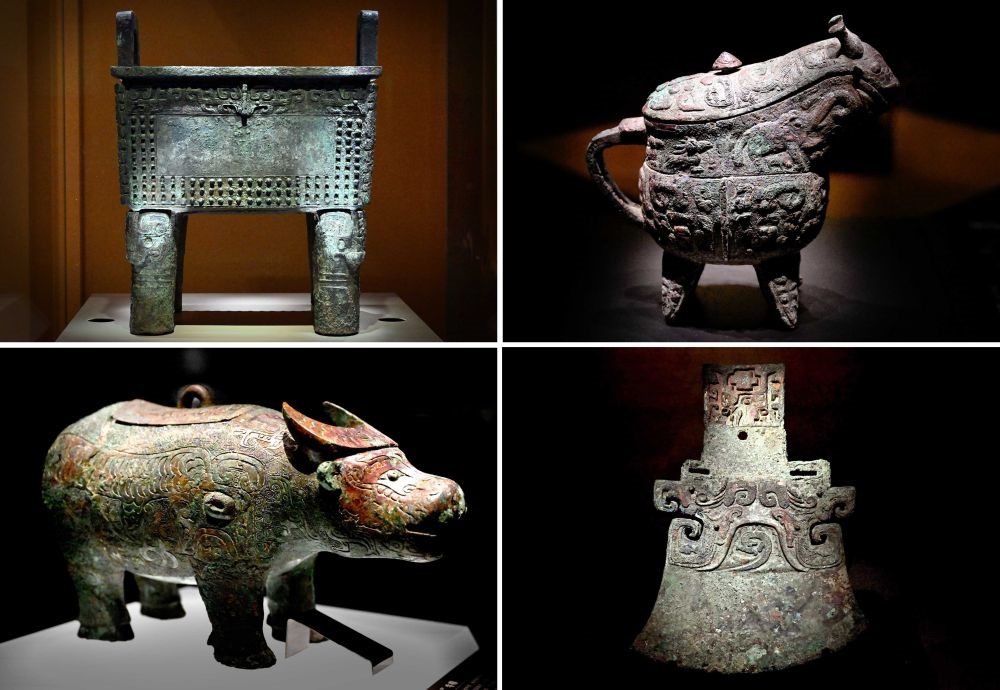 這是殷墟博物館新館內(nèi)展出的“司母辛”銅鼎（左上）、“亞長”銅?。ㄓ疑希?、“亞長”牛尊（左下）、“亞長”銅鉞（拼版照片，2月23日攝）。
